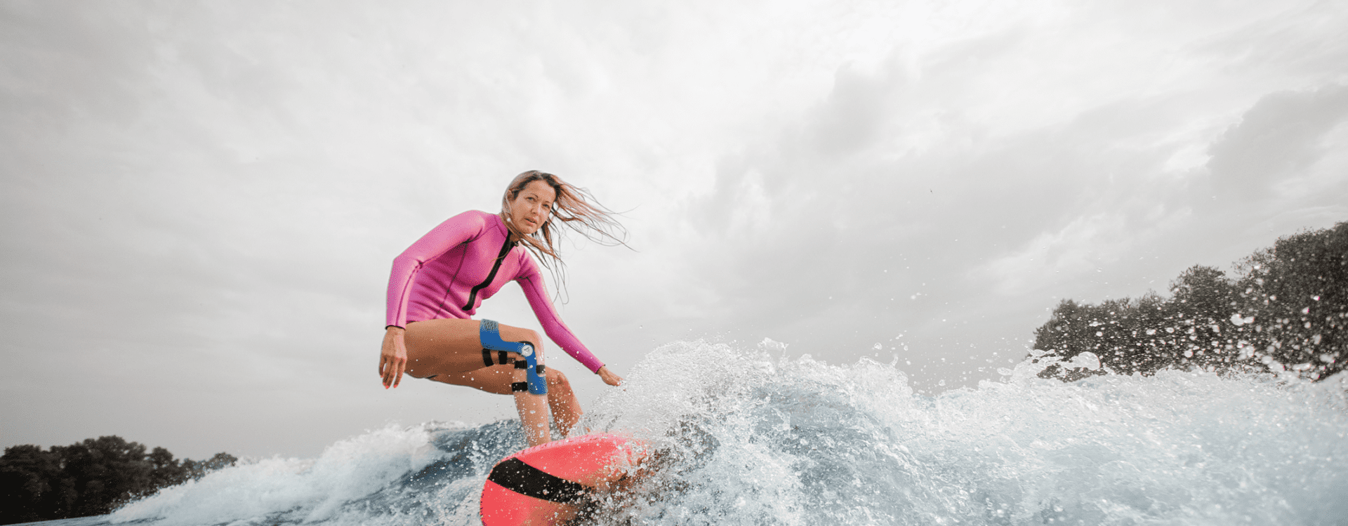 Surfing with knee brace