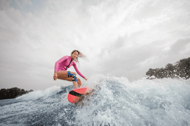 Surfing with knee brace