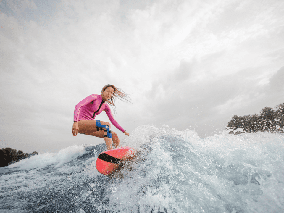 Surfing with knee brace